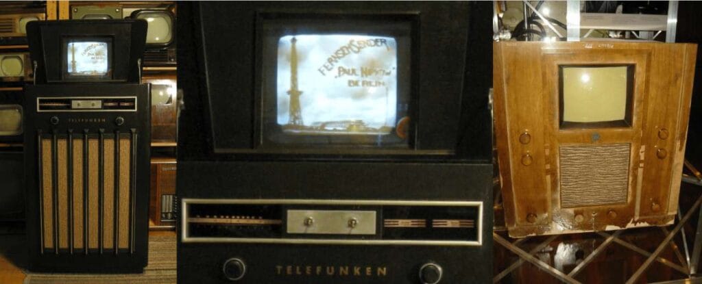 Televisor de mueble de madera Telefunken con la pantalla encendida mostrando el rótulo Fernsehsender Paul Nipkow.
